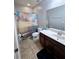 Bathroom with vanity, shower/tub combo, and ocean-themed curtain at 1109 Brenton Manor Dr, Winter Haven, FL 33881