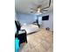 Bedroom with ceiling fan, TV, and tile flooring at 1109 Brenton Manor Dr, Winter Haven, FL 33881