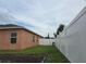 Spacious backyard with a large grassy area and privacy fence at 1109 Brenton Manor Dr, Winter Haven, FL 33881