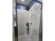 Clean shower with tiled walls and a three-tiered corner shelf at 1109 Brenton Manor Dr, Winter Haven, FL 33881