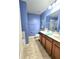 Bathroom with double sinks, a toilet and walk-in shower at 1109 Brenton Manor Dr, Winter Haven, FL 33881