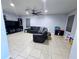 Spacious living room featuring a sectional sofa and large TV at 1109 Brenton Manor Dr, Winter Haven, FL 33881