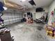 Attached garage with ample storage and overhead shelving at 1109 Brenton Manor Dr, Winter Haven, FL 33881