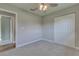 Bright bedroom with ceiling fan, carpet flooring, and neutral wall colors at 2350 E Washington St, Bartow, FL 33830