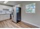 Modern kitchen features white cabinets, stainless steel appliances, and light wood flooring at 2350 E Washington St, Bartow, FL 33830