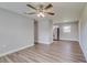 Living room featuring wood-look vinyl flooring and ceiling fan at 2350 E Washington St, Bartow, FL 33830