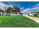 Charming ranch home with a well-maintained lawn and driveway at 2350 E Washington St, Bartow, FL 33830