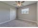 Spacious bedroom with ceiling fan, carpet, and large closet at 2350 E Washington St, Bartow, FL 33830