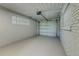 Bright and spacious garage with an overhead door and painted concrete floor at 2350 E Washington St, Bartow, FL 33830