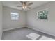 Bright bedroom with ceiling fan, carpet flooring, and neutral wall colors at 2350 E Washington St, Bartow, FL 33830