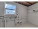 Laundry area with shelving and plumbing for a washer and dryer at 2350 E Washington St, Bartow, FL 33830