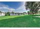 Large backyard with lush green grass and mature trees at 2350 E Washington St, Bartow, FL 33830
