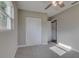 Bedroom with ceiling fan, carpet, and double door closet at 2350 E Washington St, Bartow, FL 33830