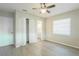 Bright bedroom with ceiling fan, large closet, and window with blinds at 121 Coleman Rd, Winter Haven, FL 33880