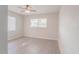 Well-lit bedroom with ceiling fan, wood-look flooring, and window blinds at 121 Coleman Rd, Winter Haven, FL 33880