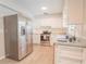 Updated kitchen with stainless steel appliances and white cabinets at 121 Coleman Rd, Winter Haven, FL 33880