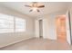 Bright bedroom with large window, ceiling fan, and spacious closet at 121 Coleman Rd, Winter Haven, FL 33880