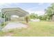 Metal carport and backyard area at 121 Coleman Rd, Winter Haven, FL 33880