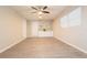 Bright office space with built-in shelving and ceiling fan at 121 Coleman Rd, Winter Haven, FL 33880