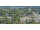 Aerial view of a house in a residential neighborhood near a lake at 121 Coleman Rd, Winter Haven, FL 33880