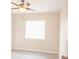 Spacious bedroom with ceiling fan and large window, offering ample natural light at 121 Coleman Rd, Winter Haven, FL 33880
