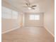 Spacious living room with large windows and ceiling fan at 121 Coleman Rd, Winter Haven, FL 33880