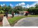 Community pool with surrounding fence, lounge chairs, and a pool house at 6128 Topher Trl # 6128, Mulberry, FL 33860