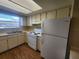 Efficient kitchen with white appliances and wood-look floors at 6128 Topher Trl # 6128, Mulberry, FL 33860