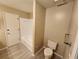 Bathroom with a bathtub, toilet and tiled floors at 6128 Topher Trl # 6128, Mulberry, FL 33860