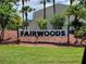 Fairwoods community entrance sign, landscaping, and manicured lawn at 6128 Topher Trl # 6128, Mulberry, FL 33860