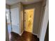 Hallway with wood-look floors and access to bathroom and closet at 6128 Topher Trl # 6128, Mulberry, FL 33860