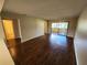 Living room with dark wood laminate flooring at 6128 Topher Trl # 6128, Mulberry, FL 33860