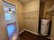 Laundry closet with shelving and water heater at 6128 Topher Trl # 6128, Mulberry, FL 33860