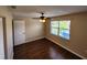 Bright bedroom with wood-look floors and a ceiling fan at 6128 Topher Trl # 6128, Mulberry, FL 33860