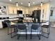 Modern kitchen with large island and granite countertops at 648 Meandering Way, Polk City, FL 33868