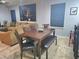 Dining area with a wood table, bench, and four chairs at 1109 Brenton Manor Dr, Winter Haven, FL 33881