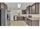 Kitchen with dark wood cabinets and stainless steel appliances at 6838 Glenbrook Dr, Lakeland, FL 33811