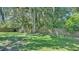 Backyard with grassy lawn and wooden fence at 6838 Glenbrook Dr, Lakeland, FL 33811
