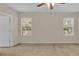 Light and airy bedroom with neutral walls and carpet at 6838 Glenbrook Dr, Lakeland, FL 33811