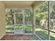 Screened porch with wood-like tile flooring at 6838 Glenbrook Dr, Lakeland, FL 33811