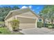 Attached garage with double door and driveway at 6838 Glenbrook Dr, Lakeland, FL 33811