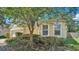 House exterior with landscaping and garage at 6838 Glenbrook Dr, Lakeland, FL 33811
