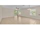 Spacious living room with tile floors and lots of natural light at 6838 Glenbrook Dr, Lakeland, FL 33811