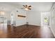 Living room with dark hardwood floors and ceiling fan at 1618 Birchwood Loop, Lakeland, FL 33811