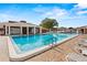 Community pool with lounge chairs and gazebo at 1618 Birchwood Loop, Lakeland, FL 33811