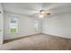 Spacious bedroom with ceiling fan and neutral carpeting at 1618 Birchwood Loop, Lakeland, FL 33811