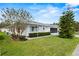 Single-story house with a landscaped yard at 1618 Birchwood Loop, Lakeland, FL 33811