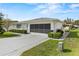 Exterior view of a single story home with garage and driveway at 1618 Birchwood Loop, Lakeland, FL 33811