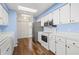 Modern kitchen with stainless steel appliances and laminate wood flooring at 1618 Birchwood Loop, Lakeland, FL 33811