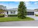 Single story home with attached garage and manicured lawn at 1618 Birchwood Loop, Lakeland, FL 33811